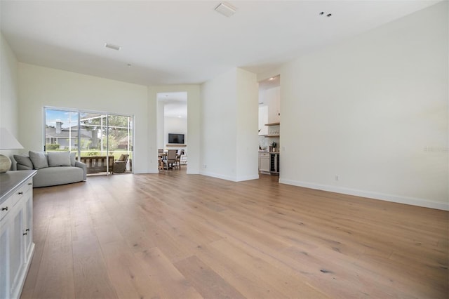 9126 Cypress Keep Ln, Odessa, FL 33556 - living room featuring light wood-style floors and wine cooler