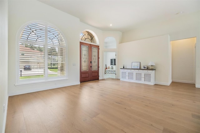 9126 Cypress Keep Ln, Odessa, FL 33556 - foyer with light wood-style floors and french doors