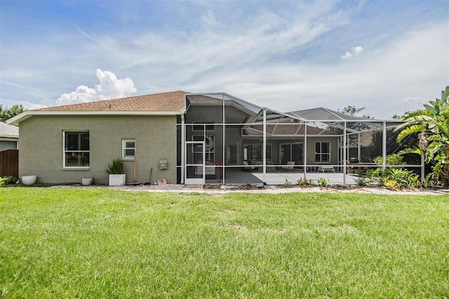 9126 Cypress Keep Ln, Odessa, FL 33556 - rear view of property featuring stucco siding, a yard, and glass enclosure