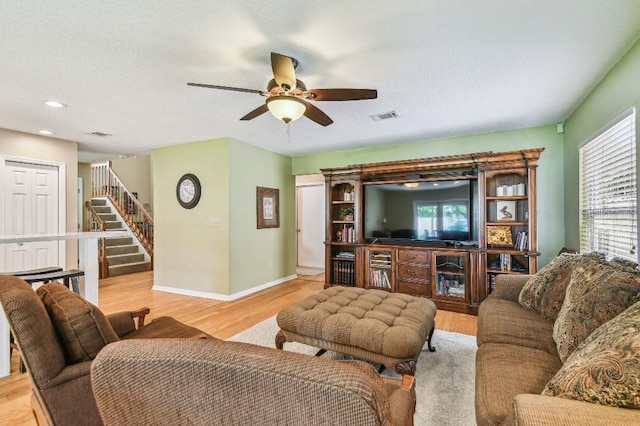 3304 W Harbor View Ave, Tampa, FL 33611 - living area with stairs, ceiling fan, light wood-style flooring, healthy amount of natural light, and recessed lighting