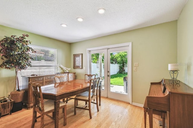 3304 W Harbor View Ave, Tampa, FL 33611 - dining area featuring french doors, a textured ceiling, light wood-style flooring, and recessed lighting