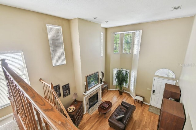 3304 W Harbor View Ave, Tampa, FL 33611 - living room featuring wood finished floors and a tiled fireplace