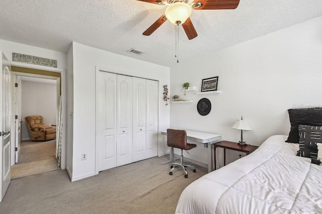 3304 W Harbor View Ave, Tampa, FL 33611 - bedroom featuring carpet flooring, a textured ceiling, a closet, and a ceiling fan
