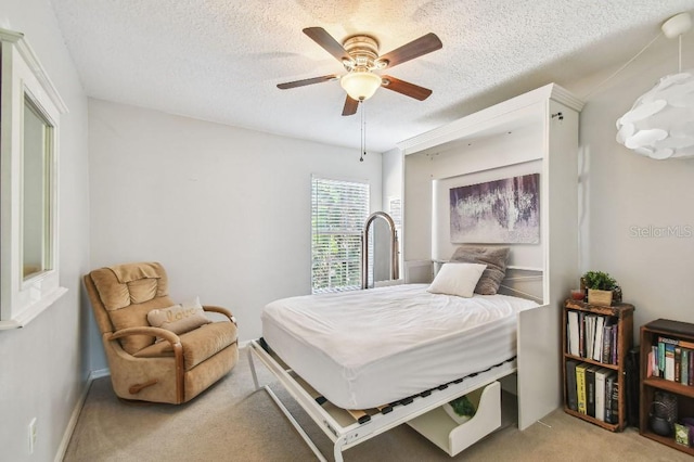 3304 W Harbor View Ave, Tampa, FL 33611 - bedroom featuring light carpet, a textured ceiling, and ceiling fan
