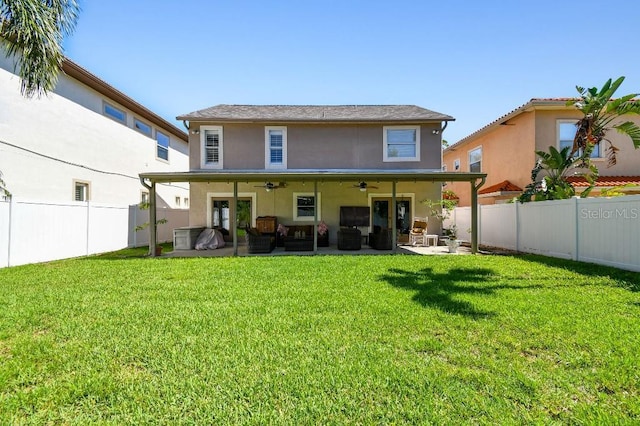 3304 W Harbor View Ave, Tampa, FL 33611 - rear view of house with ceiling fan, a fenced backyard, an outdoor living space, a patio area, and stucco siding