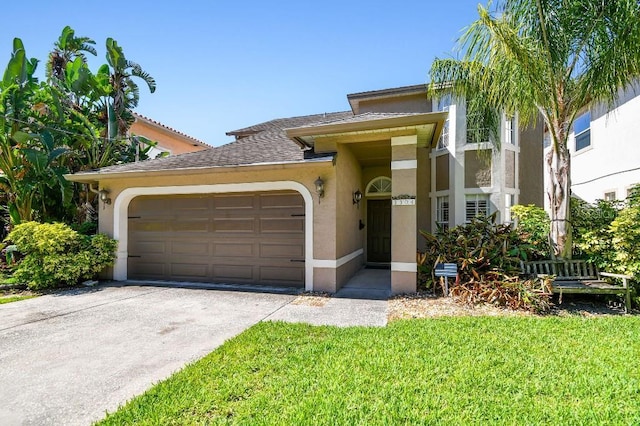 3304 W Harbor View Ave, Tampa, FL 33611 - view of front of home featuring a garage, stucco siding, concrete driveway, and a front yard
