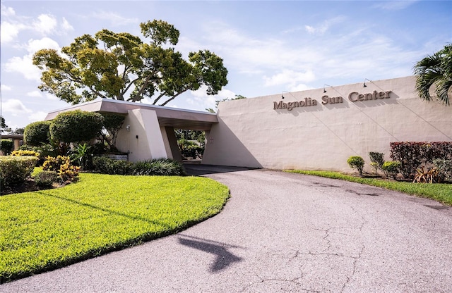 7941 58th Ave N Unit 301, Saint Petersburg, FL 33709 - view of front facade with stucco siding and a front yard