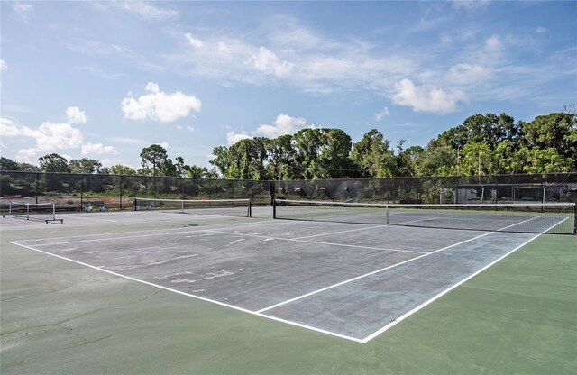 7941 58th Ave N Unit 301, Saint Petersburg, FL 33709 - view of tennis court featuring community basketball court