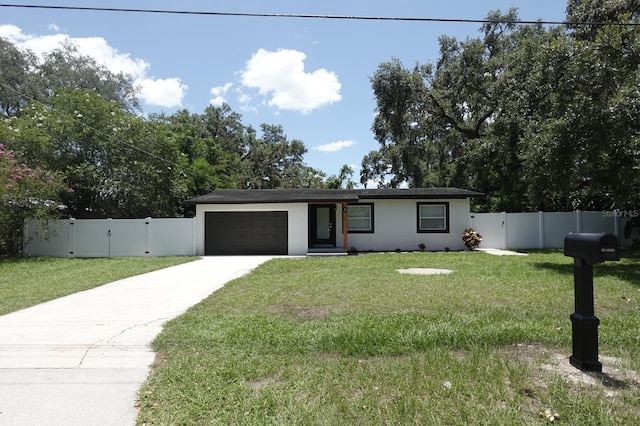 814 W 131st Ave, Tampa, FL 33612 - ranch-style home featuring a gate, an attached garage, concrete driveway, and stucco siding