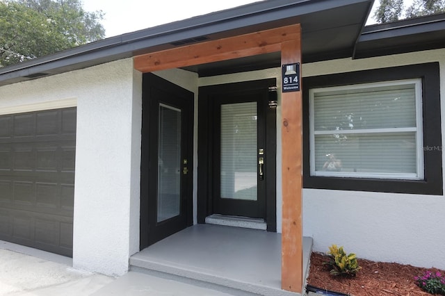 814 W 131st Ave, Tampa, FL 33612 - view of exterior entry featuring stucco siding