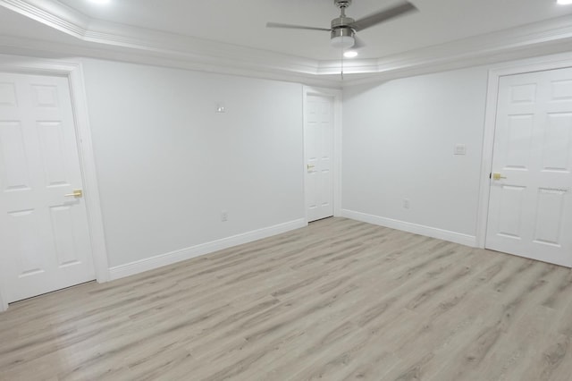 814 W 131st Ave, Tampa, FL 33612 - unfurnished room with a tray ceiling, light wood finished floors, ornamental molding, and ceiling fan