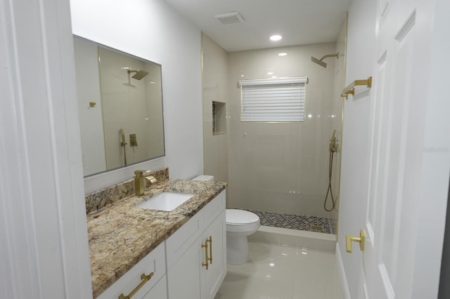 814 W 131st Ave, Tampa, FL 33612 - full bath featuring tiled shower, vanity, tile patterned flooring, and recessed lighting