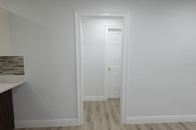 814 W 131st Ave, Tampa, FL 33612 - hallway featuring light wood-type flooring and baseboards