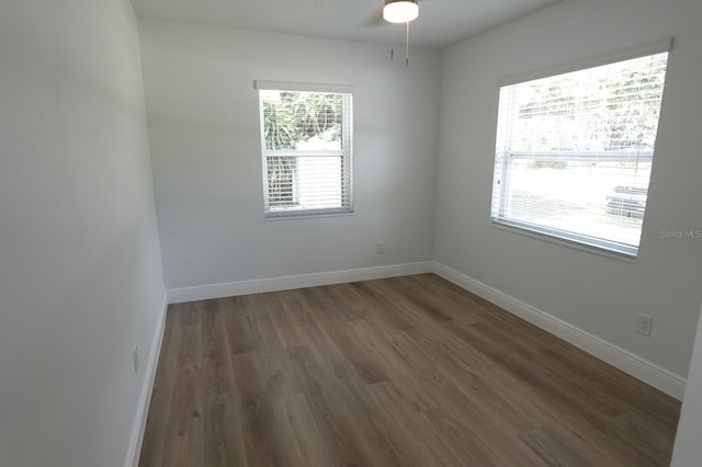 814 W 131st Ave, Tampa, FL 33612 - empty room with wood finished floors and a ceiling fan