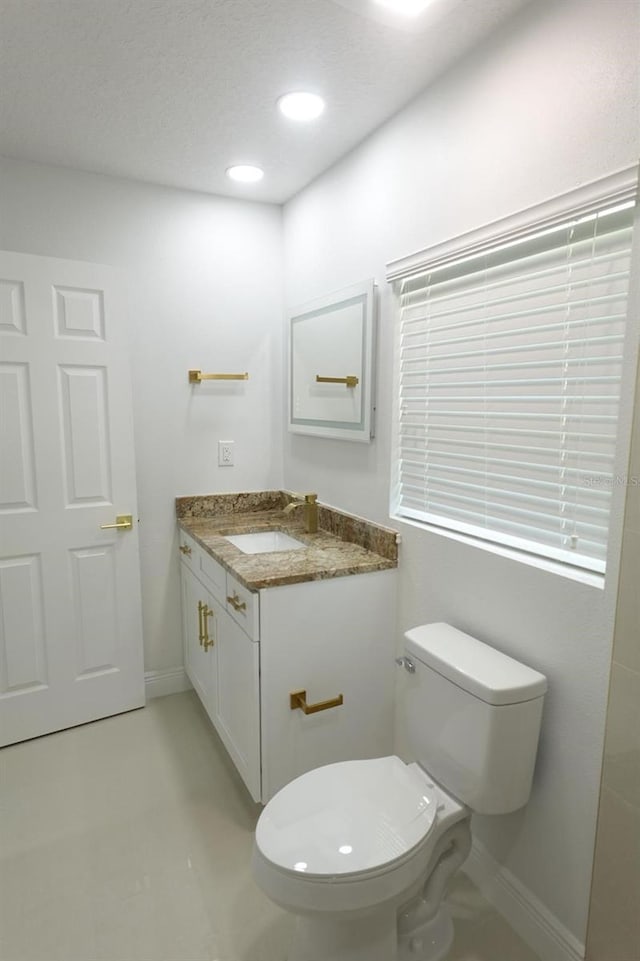 814 W 131st Ave, Tampa, FL 33612 - half bathroom featuring vanity and recessed lighting