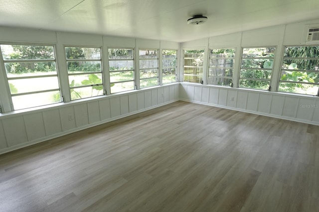 814 W 131st Ave, Tampa, FL 33612 - unfurnished sunroom featuring wood finished floors
