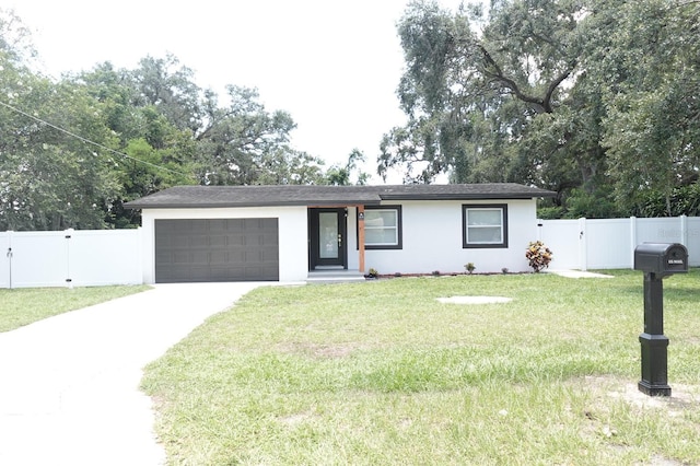814 W 131st Ave, Tampa, FL 33612 - view of front of property with a garage, driveway, stucco siding, and a gate