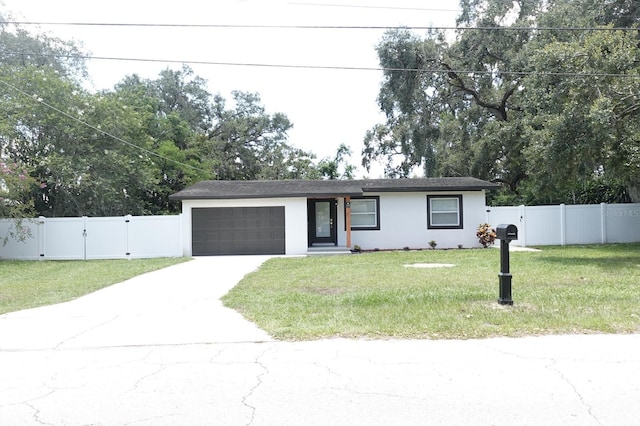 814 W 131st Ave, Tampa, FL 33612 - ranch-style house with an attached garage, stucco siding, driveway, and a gate