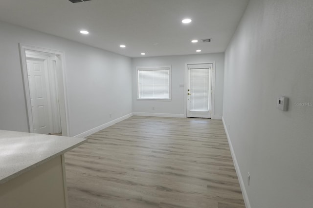 814 W 131st Ave, Tampa, FL 33612 - unfurnished dining area with light wood-type flooring and recessed lighting