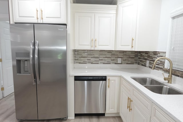 814 W 131st Ave, Tampa, FL 33612 - kitchen with stainless steel appliances, white cabinetry, decorative backsplash, and light stone counters