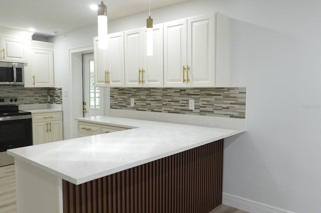 814 W 131st Ave, Tampa, FL 33612 - kitchen featuring appliances with stainless steel finishes, light wood-style floors, tasteful backsplash, light countertops, and white cabinetry