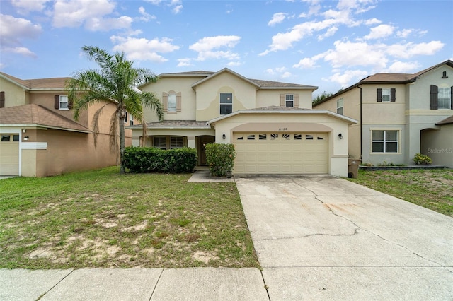 16828 N Gold Star Ct, Clermont, FL 34714 - view of front of house featuring stucco siding, a garage, concrete driveway, and a front yard