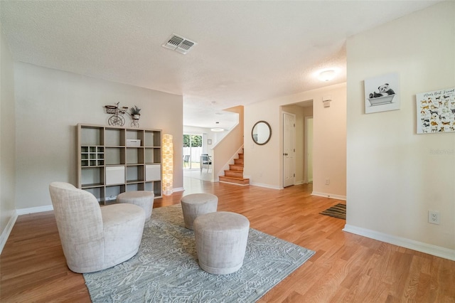 16828 N Gold Star Ct, Clermont, FL 34714 - living area with light wood-type flooring and stairway