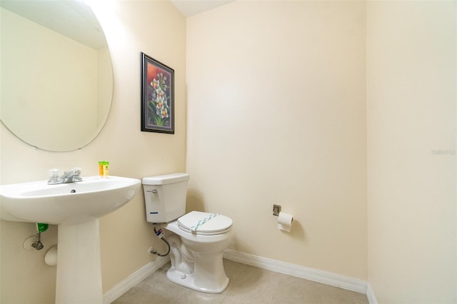 16828 N Gold Star Ct, Clermont, FL 34714 - half bathroom with toilet and tile patterned flooring