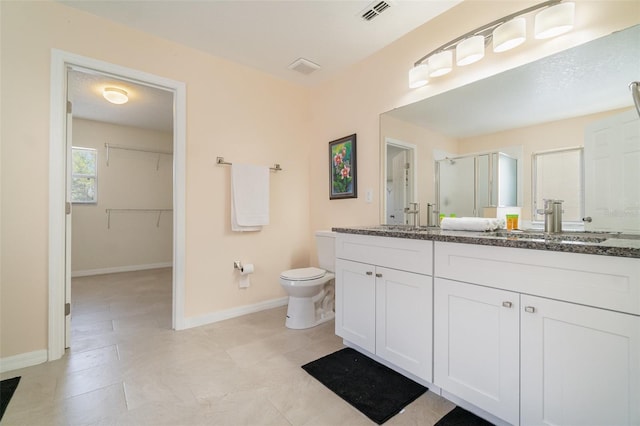 16828 N Gold Star Ct, Clermont, FL 34714 - full bathroom with a stall shower, double vanity, and a walk in closet
