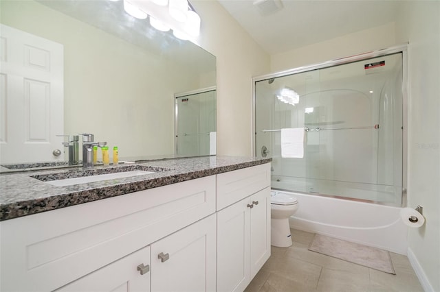 16828 N Gold Star Ct, Clermont, FL 34714 - full bathroom with vanity, combined bath / shower with glass door, and tile patterned flooring