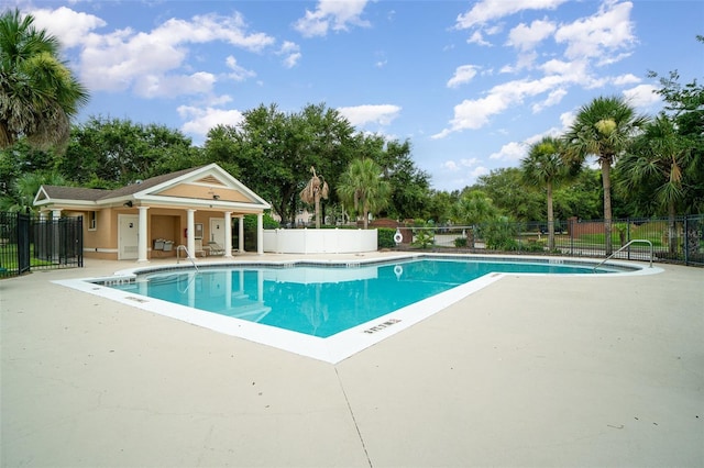 16828 N Gold Star Ct, Clermont, FL 34714 - community pool featuring a patio and view of scattered trees