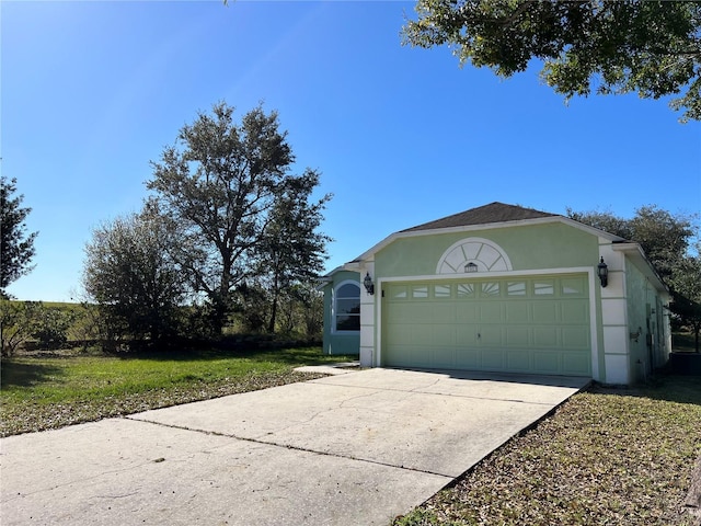 103 Thornbush Pkwy, Davenport, FL 33837 - garage with concrete driveway