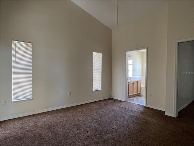 103 Thornbush Pkwy, Davenport, FL 33837 - carpeted empty room with high vaulted ceiling and baseboards