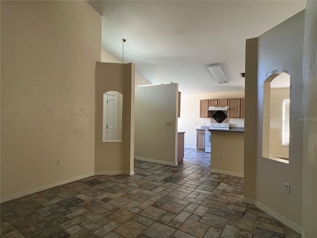 103 Thornbush Pkwy, Davenport, FL 33837 - unfurnished living room with arched walkways and stone tile floors