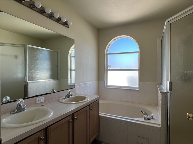 103 Thornbush Pkwy, Davenport, FL 33837 - full bathroom with a shower stall, double vanity, and a bath