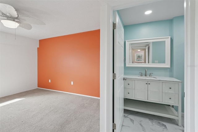14800 Walsingham Rd Unit 1215, Largo, FL 33774 - bathroom featuring vanity, a ceiling fan, marble look tiles, and recessed lighting