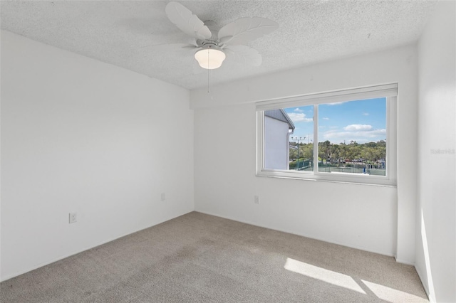 14800 Walsingham Rd Unit 1215, Largo, FL 33774 - carpeted empty room featuring a textured ceiling and ceiling fan