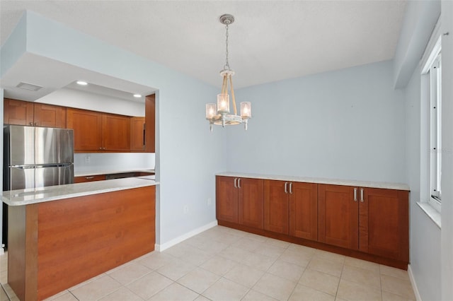 14800 Walsingham Rd Unit 1215, Largo, FL 33774 - kitchen featuring brown cabinets, light countertops, a chandelier, pendant lighting, and a peninsula