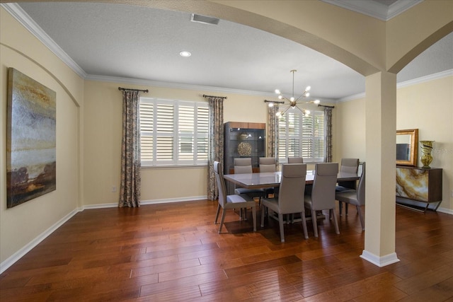 19409 Wingrove Ln, Lutz, FL 33558 - dining area with a chandelier, hardwood / wood-style floors, arched walkways, ornamental molding, and recessed lighting