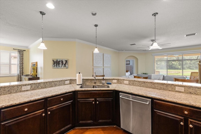 19409 Wingrove Ln, Lutz, FL 33558 - kitchen with stainless steel dishwasher, plenty of natural light, arched walkways, light stone countertops, and ornamental molding