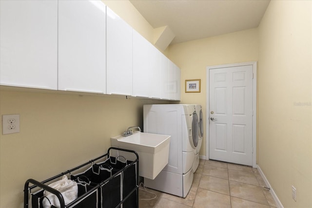 19409 Wingrove Ln, Lutz, FL 33558 - washroom with cabinet space, washing machine and dryer, and light tile patterned floors