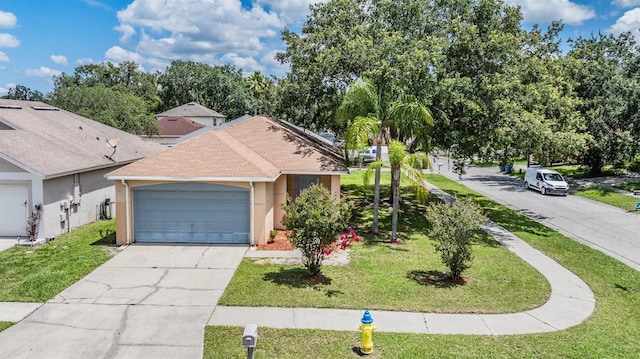 11022 Connacht Way, Tampa, FL 33610 - view of front of property featuring stucco siding, roof with shingles, a front yard, and driveway