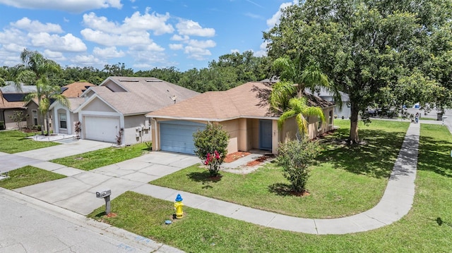 11022 Connacht Way, Tampa, FL 33610 - view of front of home featuring stucco siding, an attached garage, a front yard, and concrete driveway