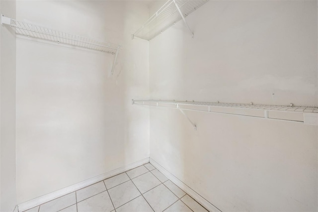 11022 Connacht Way, Tampa, FL 33610 - spacious closet featuring light tile patterned floors