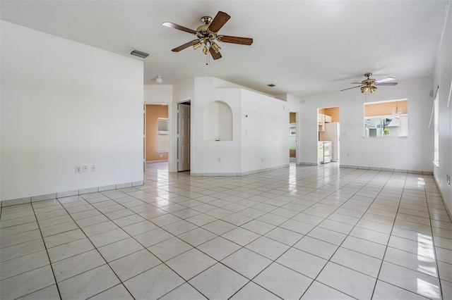 11022 Connacht Way, Tampa, FL 33610 - unfurnished living room with ceiling fan and light tile patterned flooring