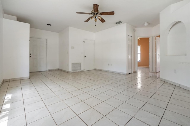 11022 Connacht Way, Tampa, FL 33610 - empty room with a ceiling fan and light tile patterned flooring