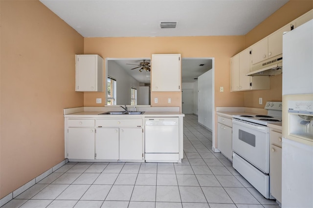 11022 Connacht Way, Tampa, FL 33610 - kitchen with white appliances, under cabinet range hood, ceiling fan, light countertops, and white cabinets