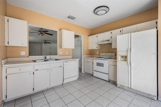 11022 Connacht Way, Tampa, FL 33610 - kitchen featuring white appliances, under cabinet range hood, a ceiling fan, light countertops, and white cabinetry