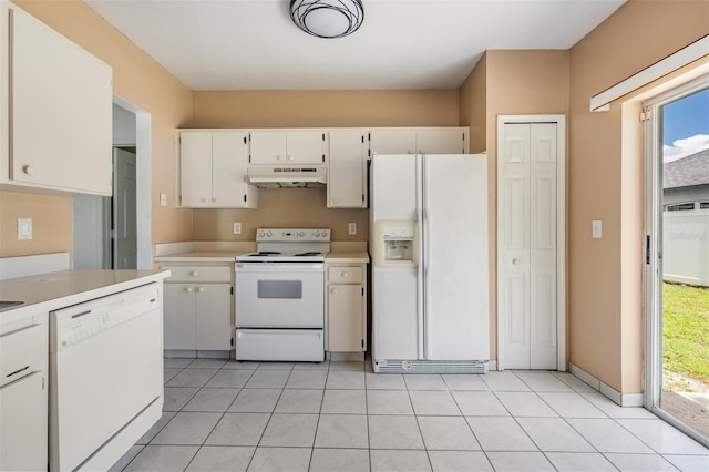 11022 Connacht Way, Tampa, FL 33610 - kitchen with white appliances, under cabinet range hood, light countertops, and healthy amount of natural light