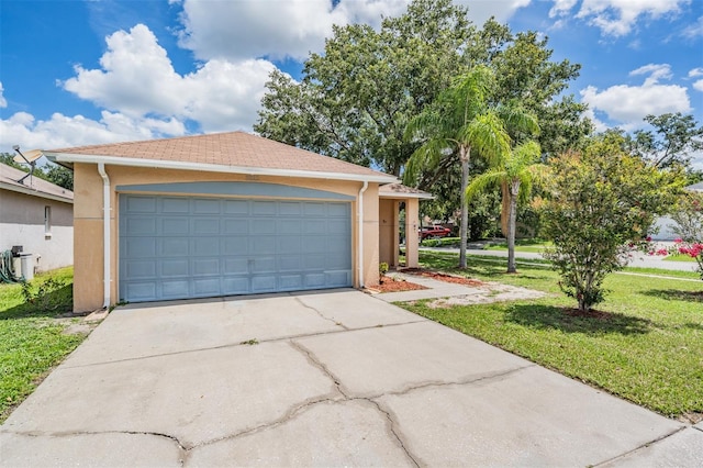 11022 Connacht Way, Tampa, FL 33610 - view of front facade featuring stucco siding, a front yard, and a detached garage